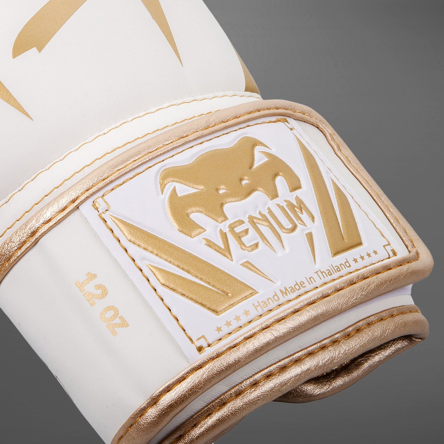 Venum Elite ボクシンググローブ：ホワイト／ゴールド
