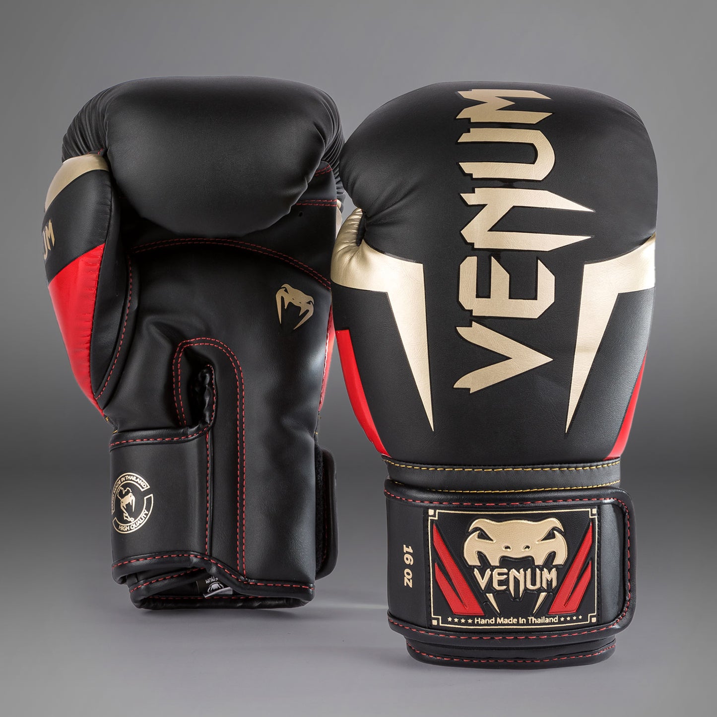 Venum Elite ボクシンググローブ - ブラック/ゴールド/レッド